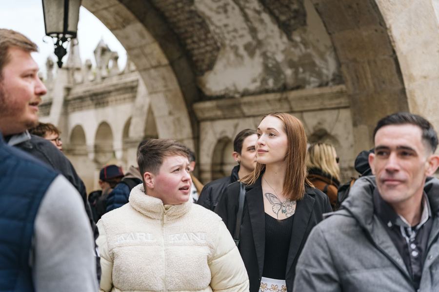 Friends walking under the arches of Fisherman's Bastion
